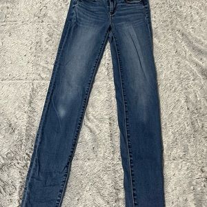 American Eagle 4 x-long skinny jeans medium wash.
